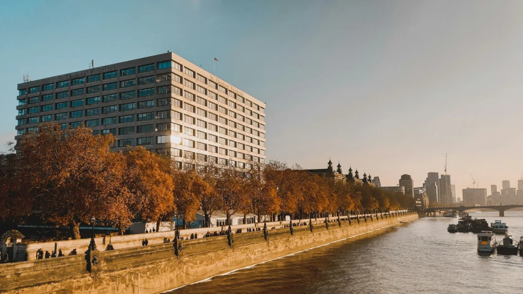 St Thomas' Hospital beside the Thames on a sunny autumn day