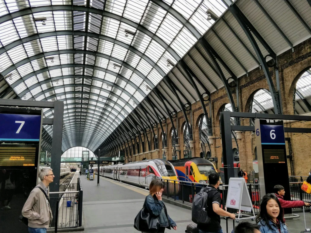 Travellers with bags on the platforms at King's Cross station